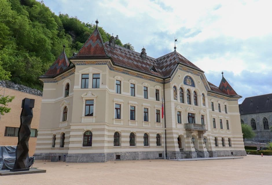 Vaduz on foot: Where to frame Liechtenstein's castle, red-roofed mansion, and border bridge