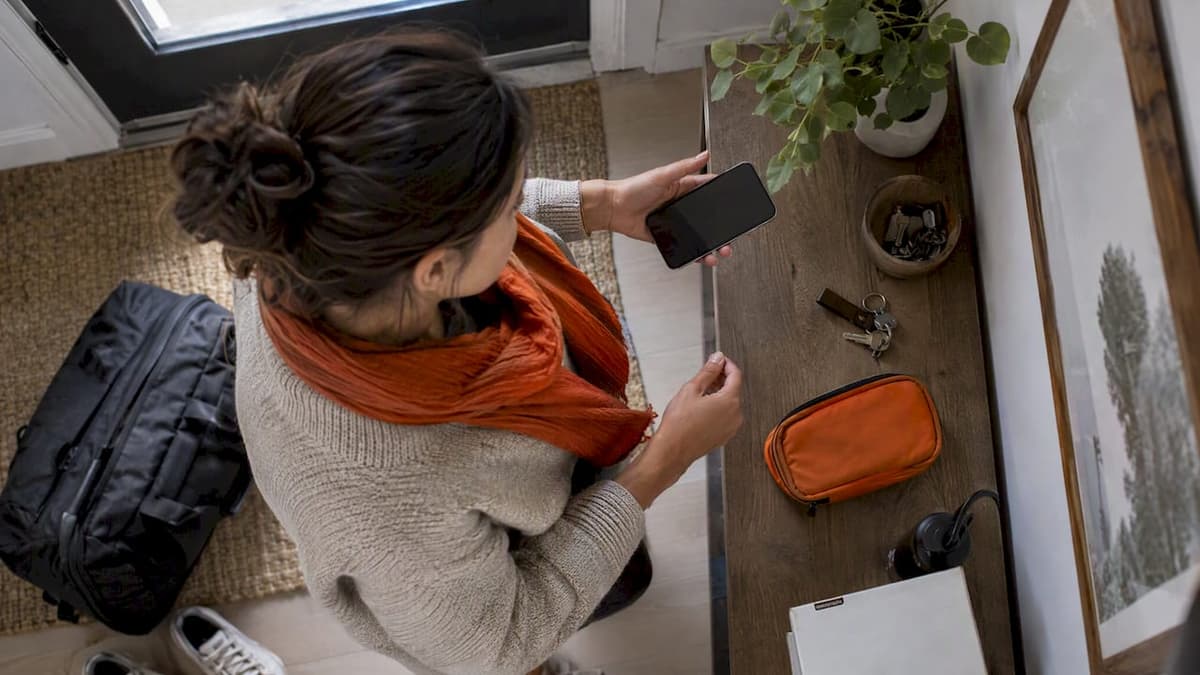 Traveler preparing a dual-SIM phone before a trip